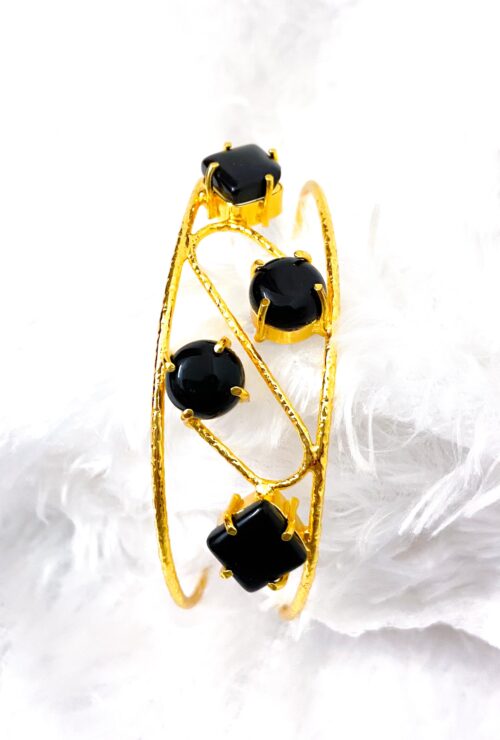 Golden bracelets with stones (black stones)