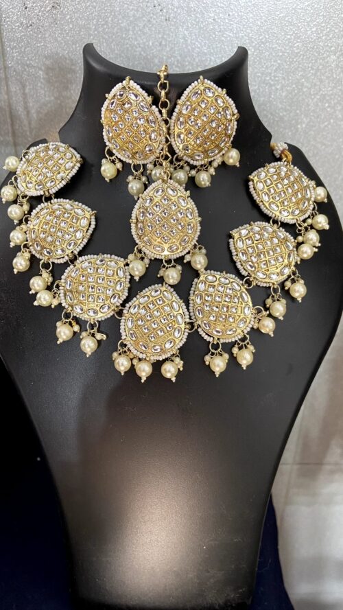 Golden Kundan Set with White pearls.