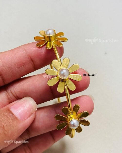 Elegant gold-plated floral cuff bracelet with pearl accents for a timeless charm. - Image 2