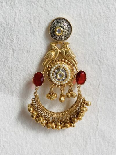 Elegant gold-plated brooch with intricate bird motifs and pearl embellishments.