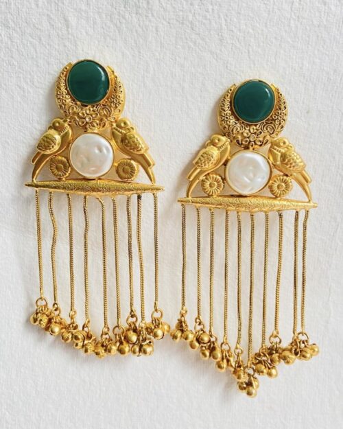 Traditional gold-plated brooch with bird motifs and cascading chain tassels.