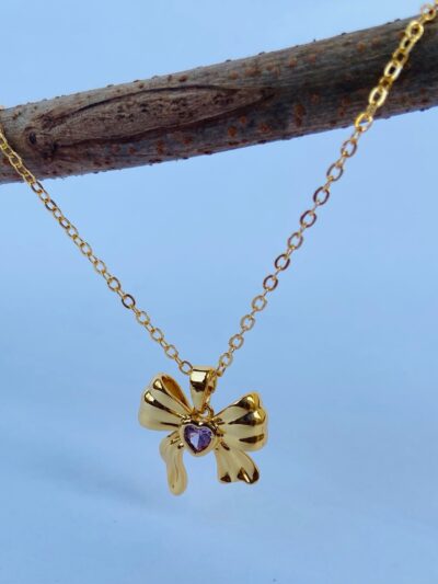 Tie your elegance together with our dainty bow pendant—graced by a purple sparkle♥️♥️
