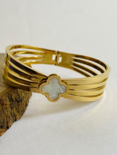 Elegant gold cuff bracelet with a white floral center for timeless style♥️♥️
