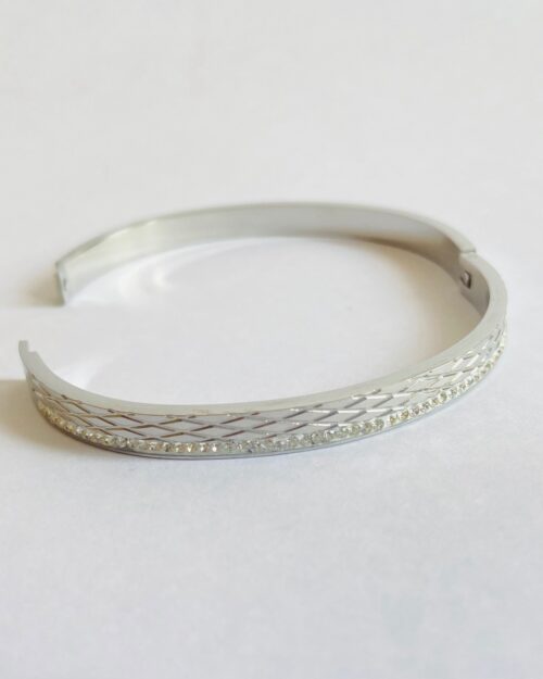 Sleek silver bangle with diamond-cut texture and elegant stone detailing - Image 4