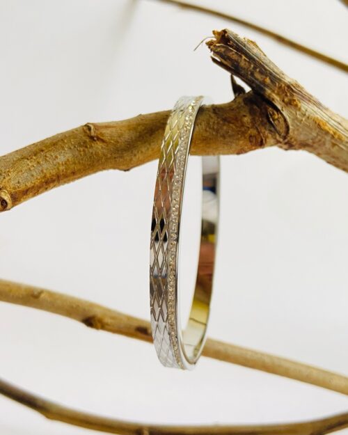Sleek silver bangle with diamond-cut texture and elegant stone detailing - Image 5